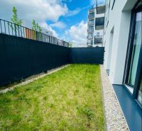 A small grassy outdoor area next to a 2-room apartment on Agátová Street, Bratislava - Dúbravka.