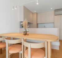 Dining table with chairs in the kitchen, floor with wood decor, 3-room apartment.