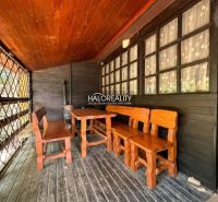 A wooden shelter of a cottage in Prašice with wooden furniture and decor.