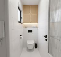 Bathroom in a 3-room apartment with white tiles and a wall-mounted toilet with storage space.