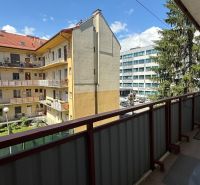 A balcony with a view of the courtyard in Zvolen on Štefánikova Street, 1-bedroom apartment.