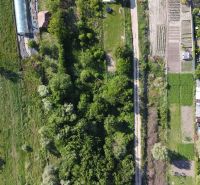 Aerial view of the Gardens in Branč with a road and diverse vegetation.