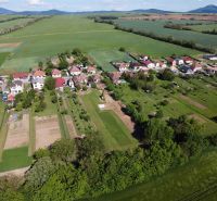 Aerial view of gardens in Hruboňovo with rural landscape and agricultural fields.