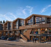 A recreational apartment in Demänovská Dolina with sports and restaurant facilities surrounded by forests.
