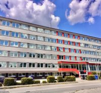 Office building with red details on Drieňová Street in Bratislava - Ružinov.