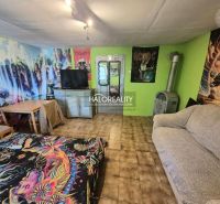 Interior with lively wallpapers, comfortable furniture, and a tiled stove, Gardens.