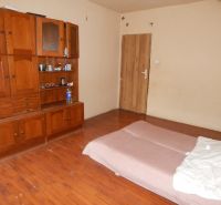Interior of a family house with wooden furniture and flooring with a wood design.