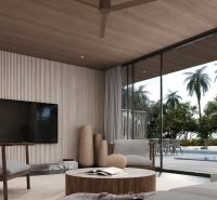 Villa with seating area, television, and views of palm trees and pool.