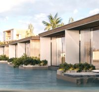 Coastal architecture in Nungwi, 1-bedroom apartment over the water with palm trees in the background.