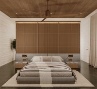 Bedroom in a villa with a wood-patterned floor and beige curtains.