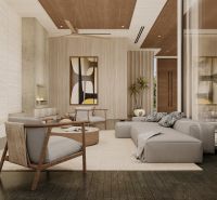 Living room in a villa with a comfortable sofa, fireplace, and floor with a wooden decor.