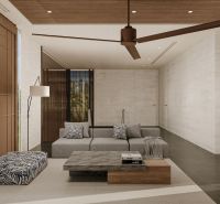 Living room in a villa with a sofa, carpet, and fan; floor with wood decor.