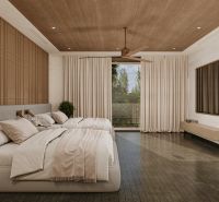 A bedroom with a large bed, curtains, and a wooden decor floor in a villa.