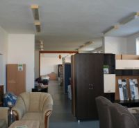 Furniture and sofa showroom. Floor with wooden decor. Furniture of various styles.