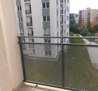View from the balcony of a 1-room apartment on Žarec Street in Čadca, visible are apartment buildings.