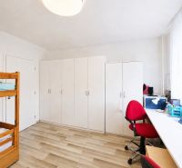 Children's room with a bunk bed, a desk, and a wooden decor floor in a 3-room apartment.