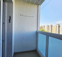 A balcony with tiles, a view of apartment buildings on Čínska Street, Sídlisko Ťahanovce, Košice.