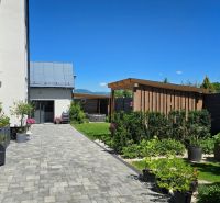 The exterior of a 3-room apartment on Banská Street in Banská Bystrica with a well-maintained garden.