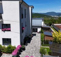 Exterior of a 3-room apartment on Banská Street in Banská Bystrica with a view of the mountains.