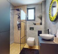 Bathroom with designer sink and shower in a 3-room apartment with a wooden decor floor.