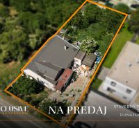 Aerial view of a plot with a house in Dunajská Lužná intended for living.