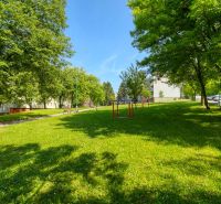 Greenery and benches on Viestova Street in Myjava near a 4-room apartment.