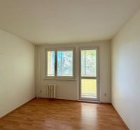 A room with light walls and a floor with a wood decor in a 4-room apartment.