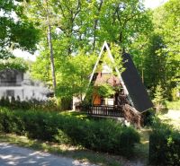 A cottage in Šaštín-Stráže on Do Gazárky Street, surrounded by green trees and nature.