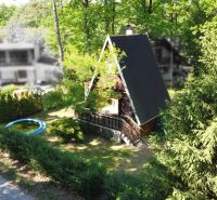 A cottage on Do Gazárky Street in Šaštín-Stráže surrounded by greenery, with a swimming pool.
