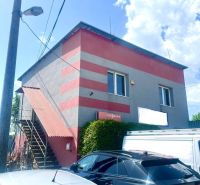 A building with commercial spaces in Košice - Sever district, with parking spaces.