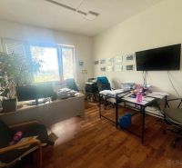 Interior of commercial spaces with offices, wooden decor flooring, table, chairs.