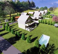 Row houses with gardens on Hlinícka Street in Myjava, surrounded by trees and a swimming pool.