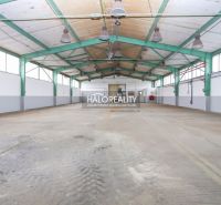 Production facilities with high ceilings and steel construction.
