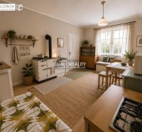 Interior of a family house with a wooden decor floor and a cozy kitchen nook.