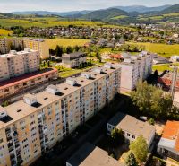 A view of the apartment complex on 9th May Street in the town of Brezno surrounded by nature.