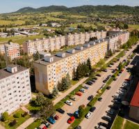A view of the housing estate with apartment buildings and greenery on 9th May Street in Brezno.