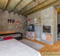 The interior of a cabin with a wooden decor floor and decorations in a natural style.