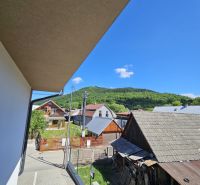 Štiavnik Street in Štiavnik with a view of family houses and green hills.