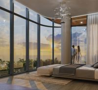 A stylish bedroom in a studio apartment with large windows and a wooden decor floor.
