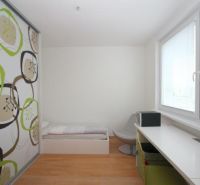 Children's room in a 3-room apartment with a wooden decor floor and a built-in wardrobe.