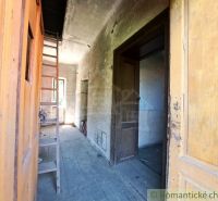 The interior of a family house with wooden doors and a floor with a wooden decor.