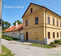 A family house in Klátova Nová Ves with a landscaped garden and a historic facade.