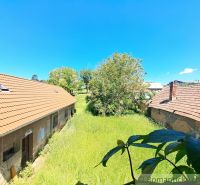 A family house in Klátova Nová Ves with a large green yard and garden.