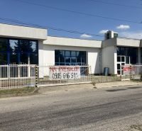 Commercial premises on 1. mája Street in Hurbanovo, with three large windows and a gate.