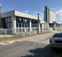 Commercial premises on 1.mája Street in Hurbanovo, white facade, parked car.