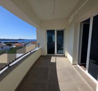 Terrace of a 2-room apartment in Žaborić with a sea view and tiling.