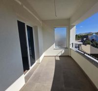 The balcony of a 2-room apartment in Žaborić with a view of the surroundings and a railing.