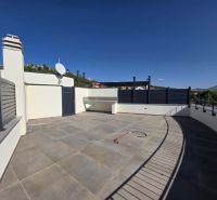 A surface terrace with tiles and a view in the Žaborič environment from a 2-room apartment.