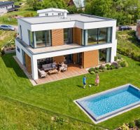 A modern house with a pool and garden in Turčianske Jaseno on a residential plot.