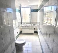 Bathroom with a toilet and a large window in a 3-room apartment.